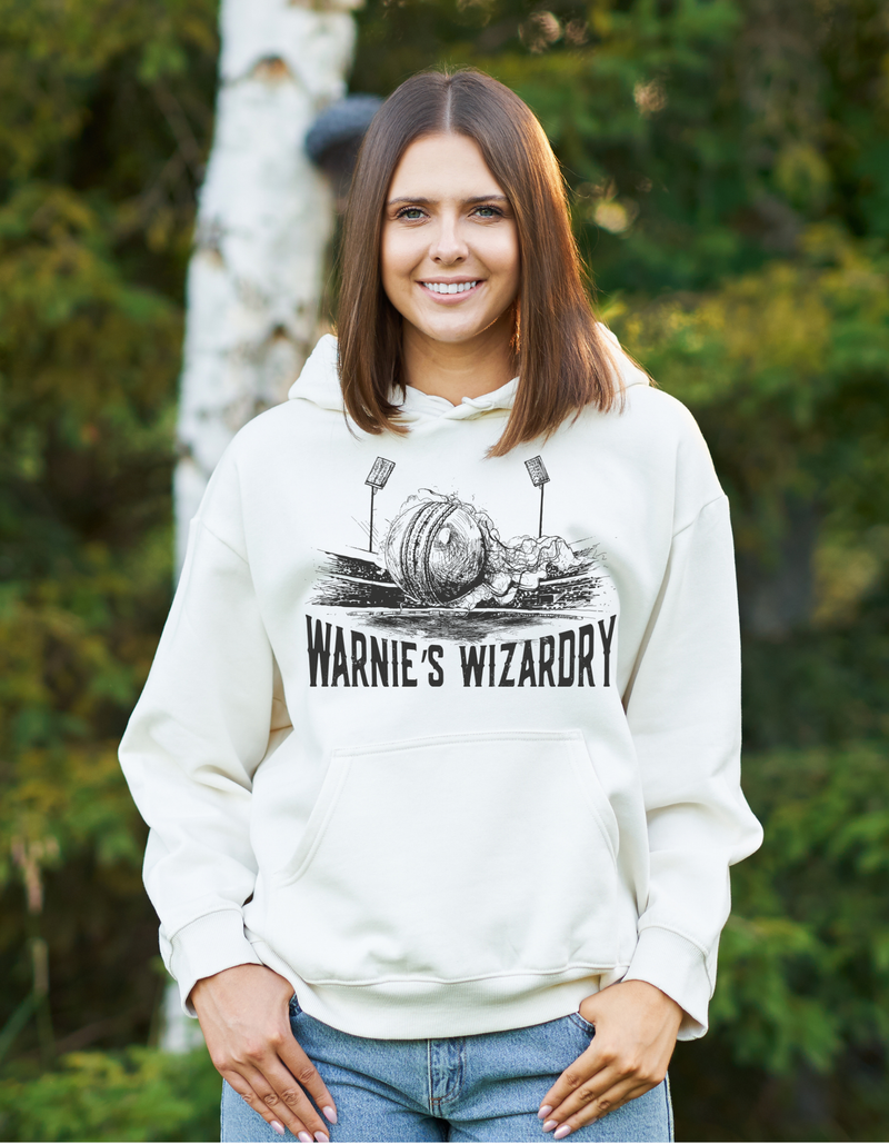 A lady wearing a white hoodie with Warne’s Wizardry on the front!  Funny Cricket Hoodie, Premium Fabric, Multiple Adult Sizes