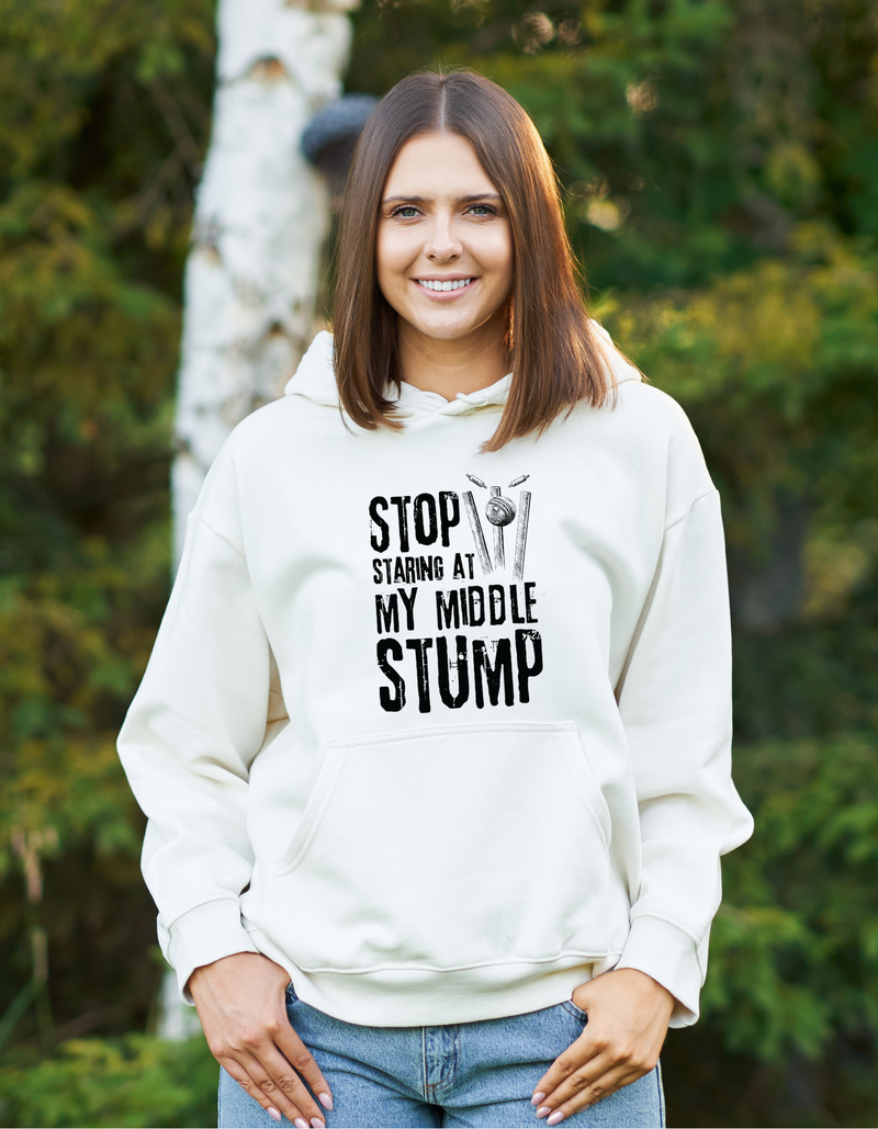 A lady wearing a white hoodie with Stop Looking at My Middle Stump on the front. A Funny Cricket Hoodie, Premium Fabric, Multiple Adult Sizes