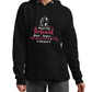 A lady wearing a black hoodie with Mum’s My Personal Third Umpire, Always Reviewing My Choices on the front. A Funny Cricket Hoodie, Premium Fabric, Multiple Junior Sizes, Perfect for Boys and Girls