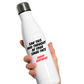 White Cows Corner water bottle with text held by a hand on a white background