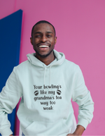 A man wearing a white hoodie with Your Bowling’s Like My Grandma’s Tea, Way Too Weak, on the front - Funny Cricket Hoodie, Premium Fabric, Multiple Adult Sizes